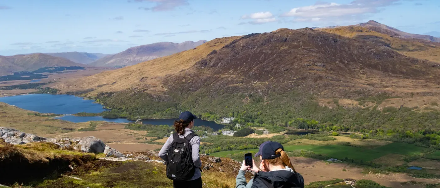 UNE Students overlooking Kylemoor Abbey in Ireland